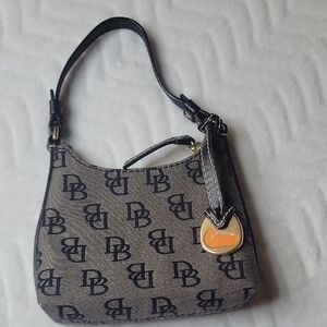 #3. Dooney & Bourke Black and Tan Mini Bag